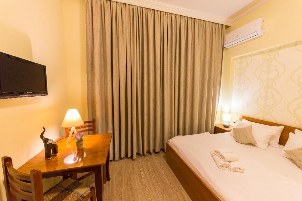 Postel nebo postele na pokoji v ubytování Hotel Baron