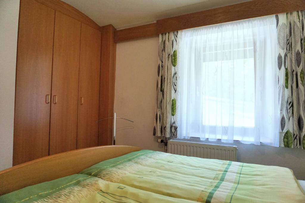 Postel nebo postele na pokoji v ubytování Gästehaus im Wiesengrund