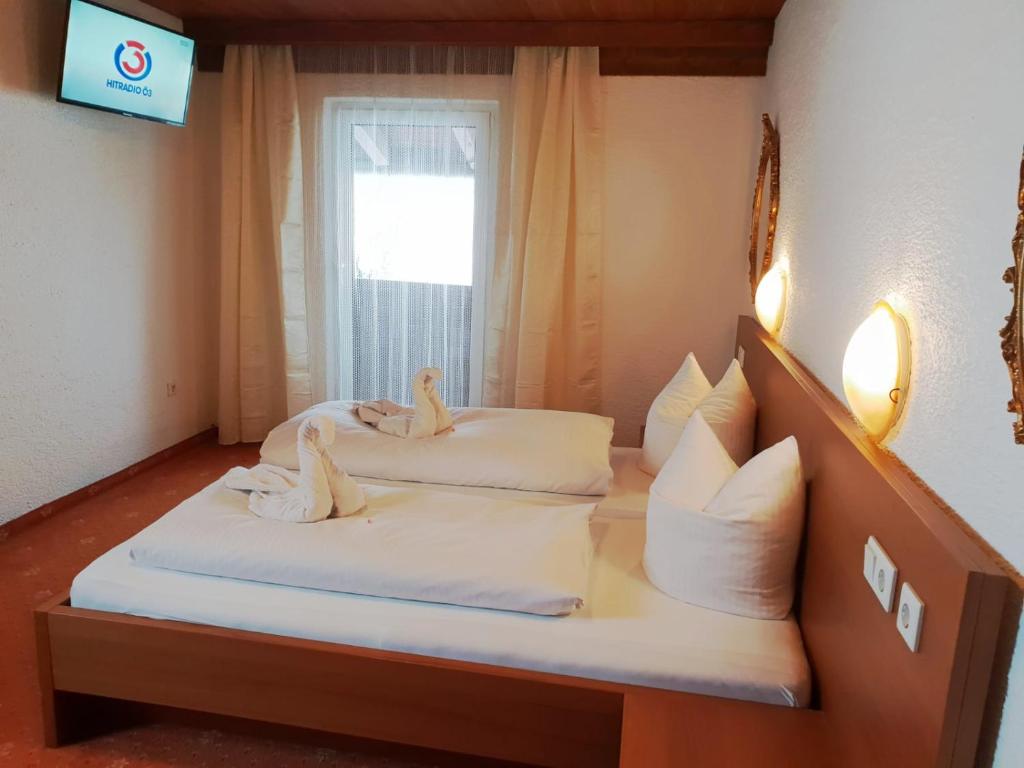 Postel nebo postele na pokoji v ubytování Hotel Reitherhof