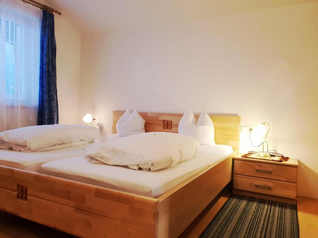 Postel nebo postele na pokoji v ubytování Hotel Reitherhof