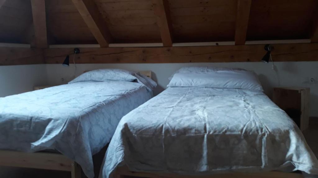 Postel nebo postele na pokoji v ubytování Casa Garrabet