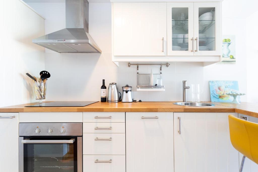 A kitchen or kitchenette at Home2Book Design Santa Úrsula Pool & Wifi