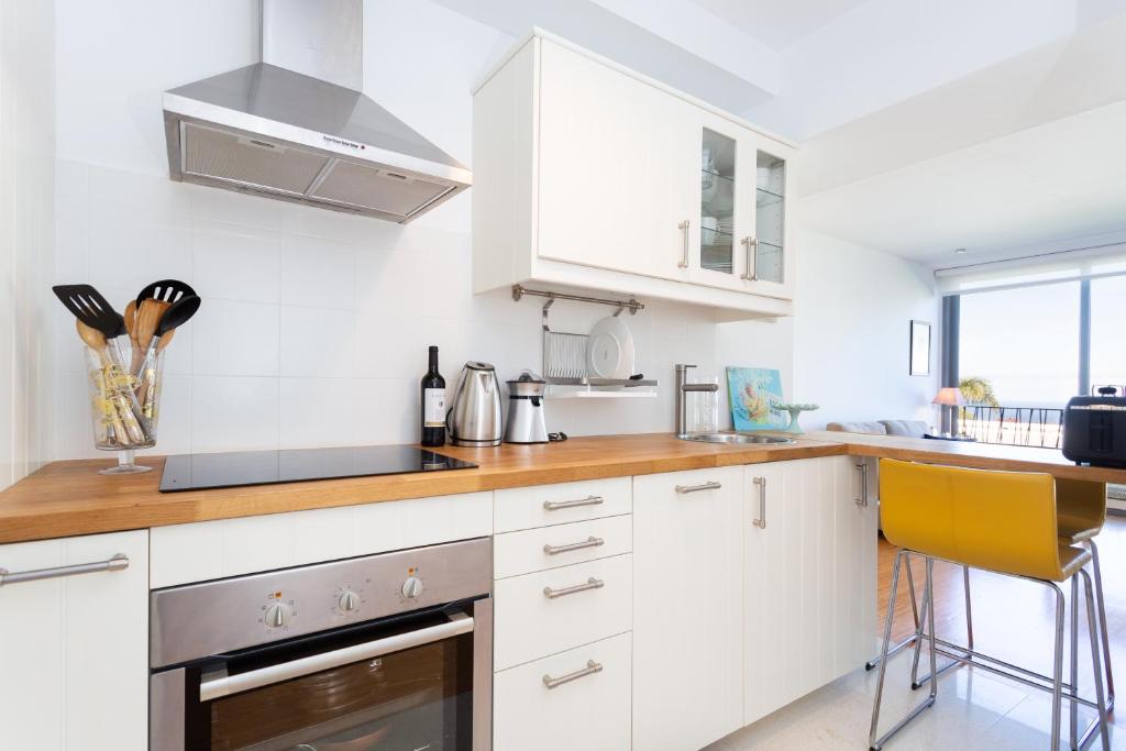 A kitchen or kitchenette at Home2Book Design Santa Úrsula Pool & Wifi