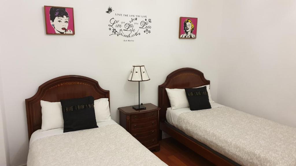Łóżko lub łóżka w pokoju w obiekcie Gran Apartamento Centro Histórico