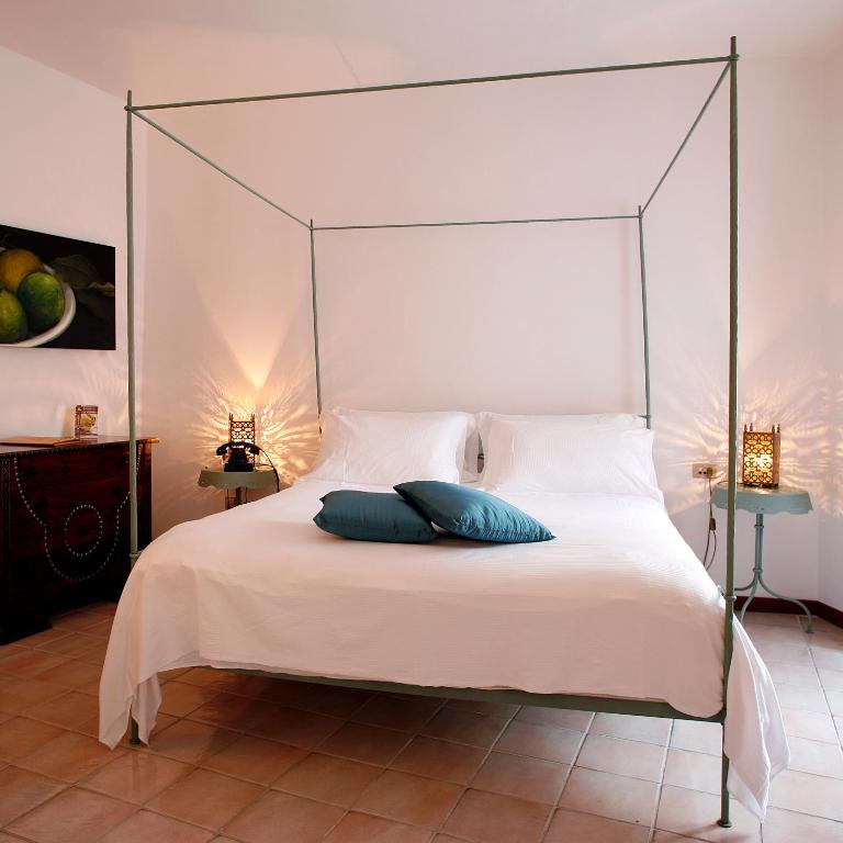 Postel nebo postele na pokoji v ubytování La Locanda Delle Donne Monache