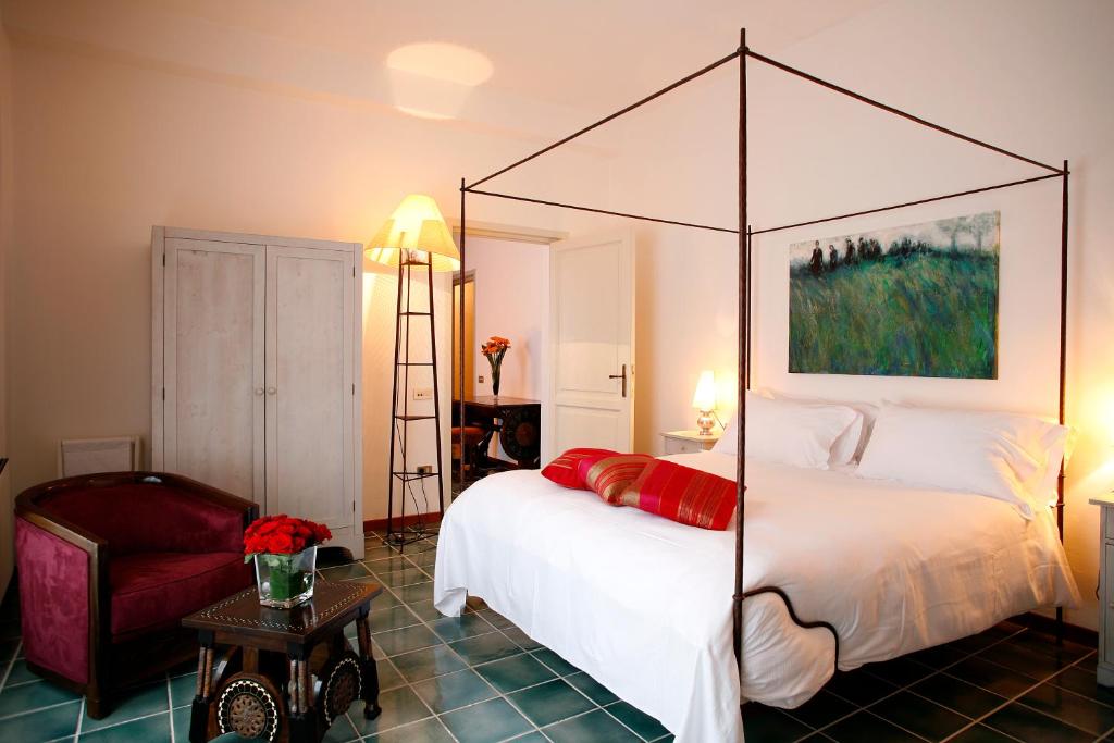 Postel nebo postele na pokoji v ubytování La Locanda Delle Donne Monache