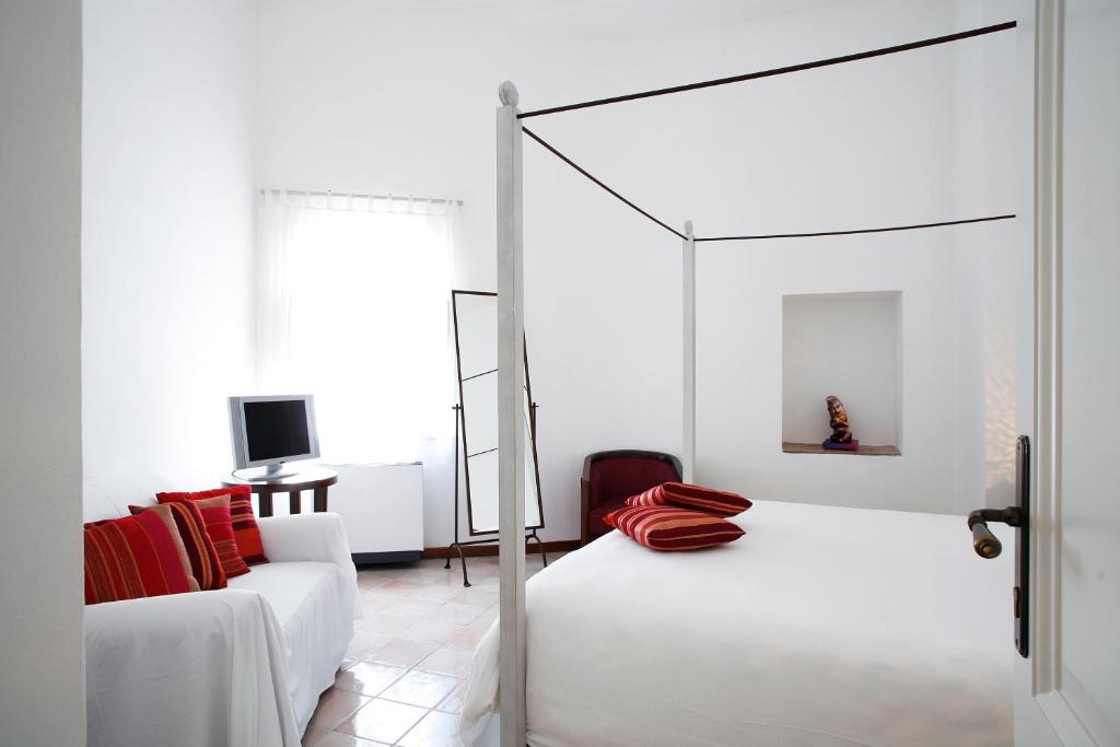 Postel nebo postele na pokoji v ubytování La Locanda Delle Donne Monache