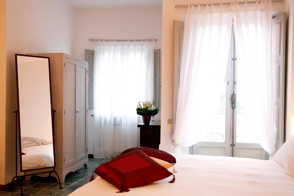 Postel nebo postele na pokoji v ubytování La Locanda Delle Donne Monache