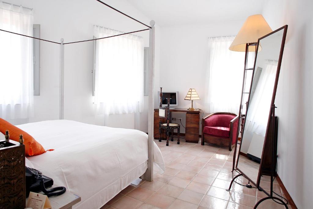 Postel nebo postele na pokoji v ubytování La Locanda Delle Donne Monache