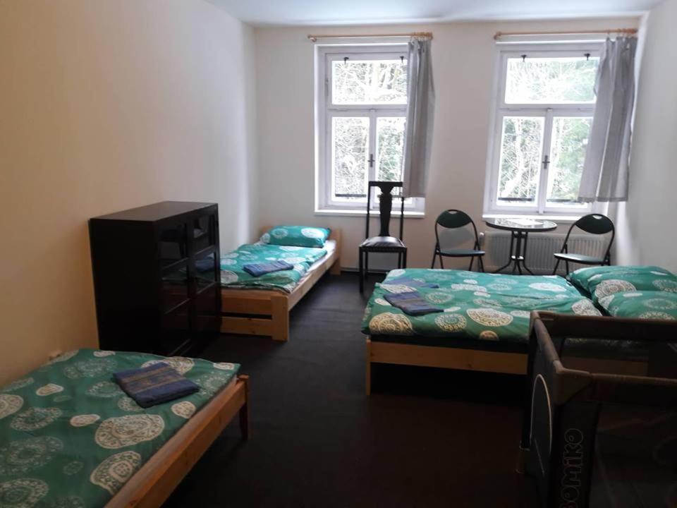 Postel nebo postele na pokoji v ubytování Apartmán pod Mariánskou horou