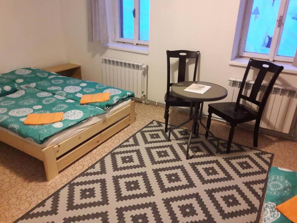 Postel nebo postele na pokoji v ubytování Apartmán pod Mariánskou horou