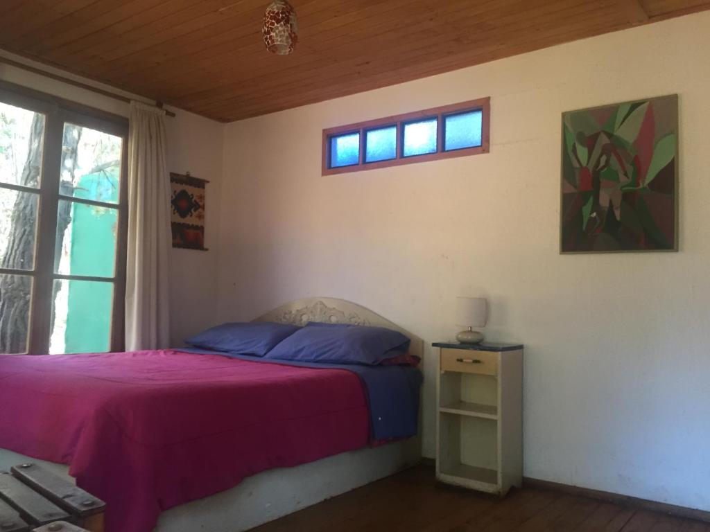 Postel nebo postele na pokoji v ubytování Cabañas La Magia de Isla Negra