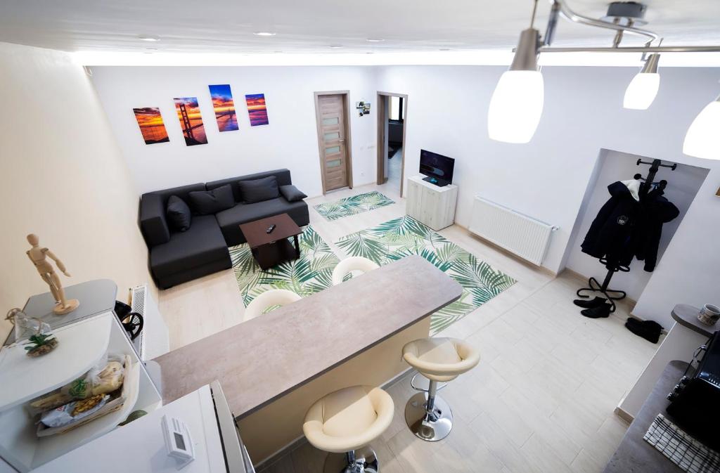 a living room with a couch and a table at Central apartment- Shumi's in Cluj-Napoca