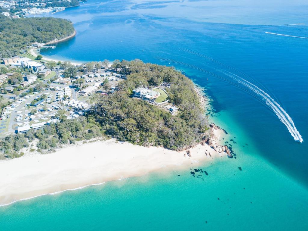 an aerial view of an island in the ocean at Halifax Holiday Park in Nelson Bay