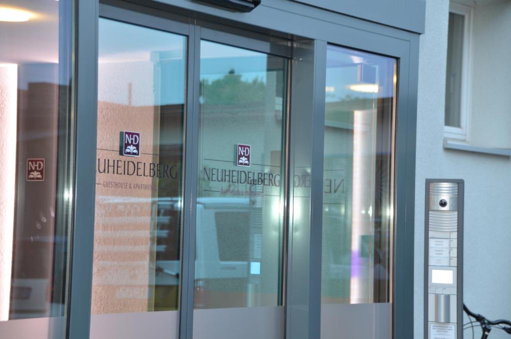 an elevator in a building with signs on it at Neu Heidelberg - Guesthouse & Apartments in Heidelberg