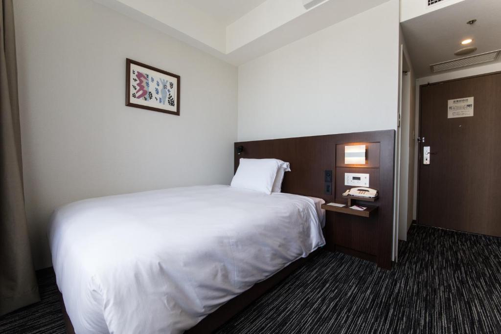Postel nebo postele na pokoji v ubytování ANA Crowne Plaza Yonago by IHG