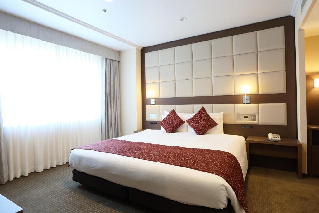 Postel nebo postele na pokoji v ubytování Loisir Hotel Toyohashi