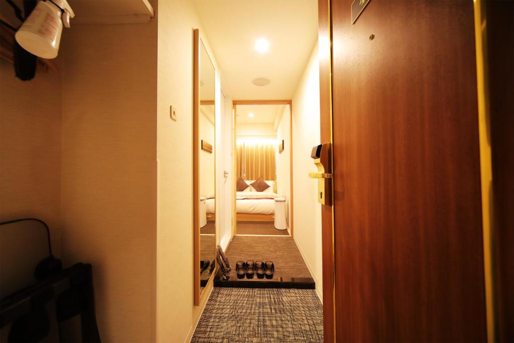 Postel nebo postele na pokoji v ubytování Hotel Sunroute Asakusa