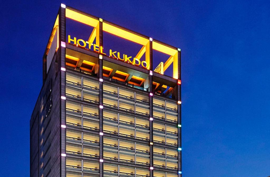 a building with a sign on top of it at Hotel Kukdo in Seoul