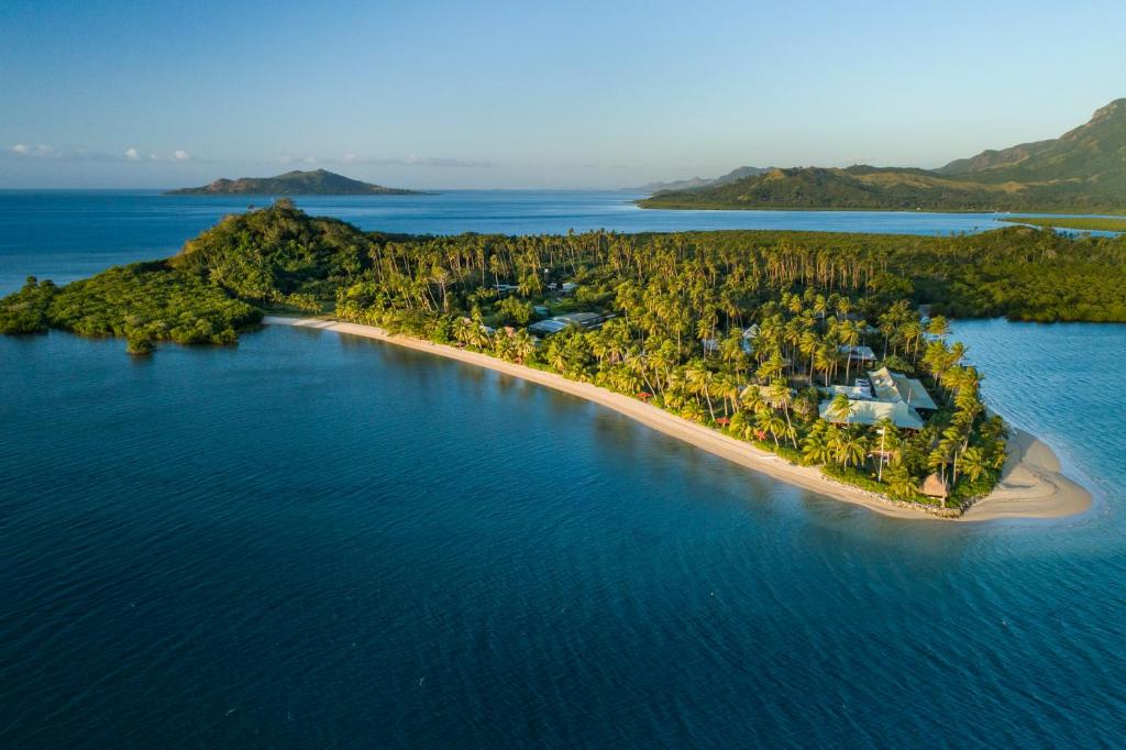 an aerial view of an island in the water at Nukubati Great Sea Reef in Nukubati