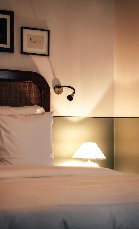 Postel nebo postele na pokoji v ubytování Hotel Sanders
