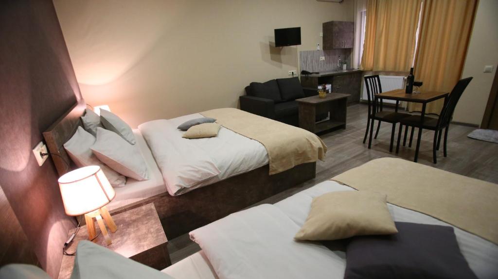 Postel nebo postele na pokoji v ubytování Hotel Nabadi