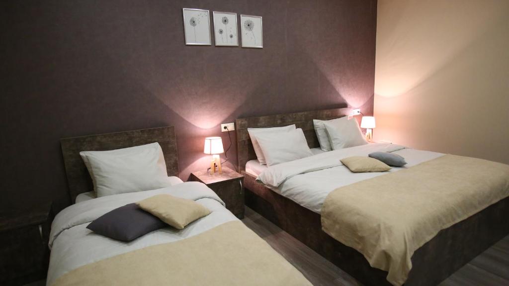 Postel nebo postele na pokoji v ubytování Hotel Nabadi