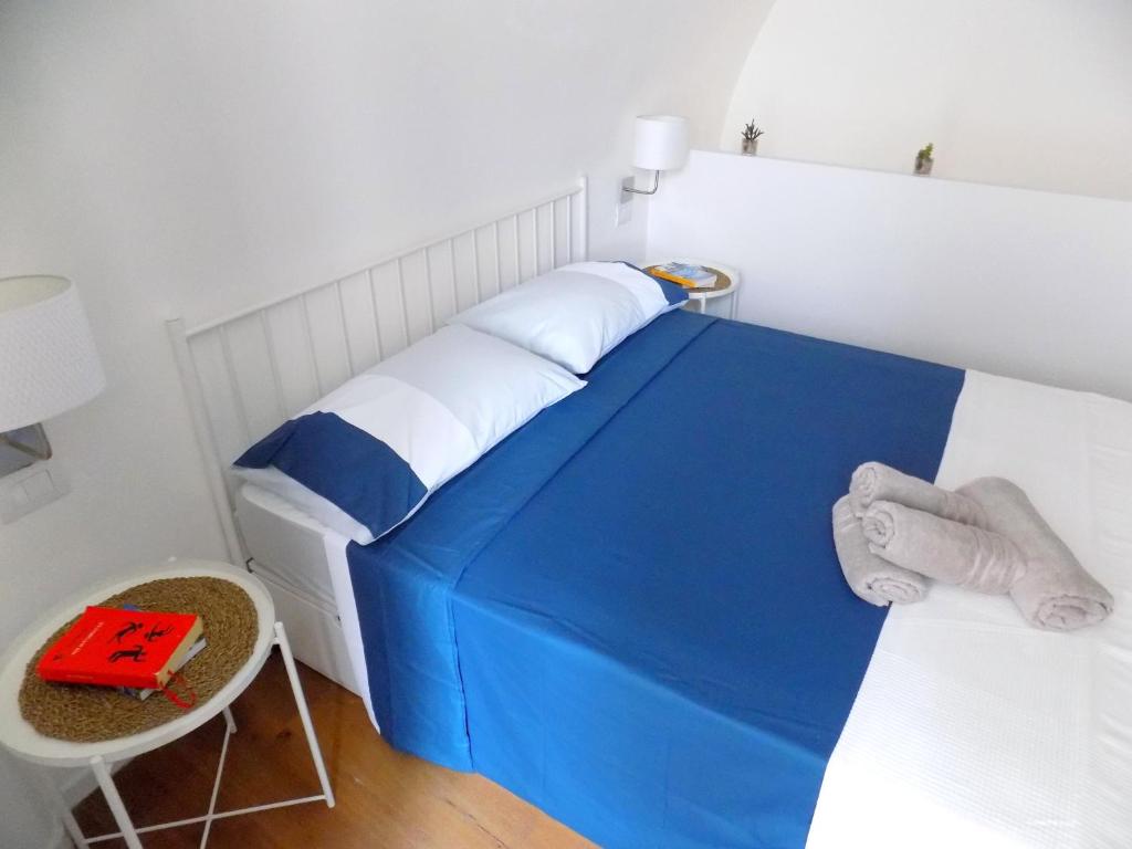 A bed or beds in a room at San Gregorio House