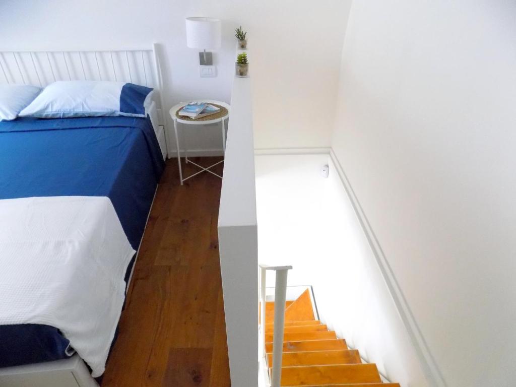 A bed or beds in a room at San Gregorio House