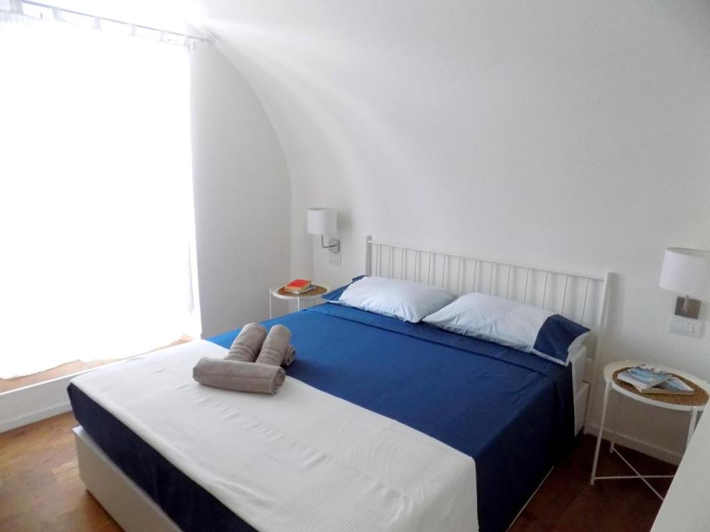A bed or beds in a room at San Gregorio House