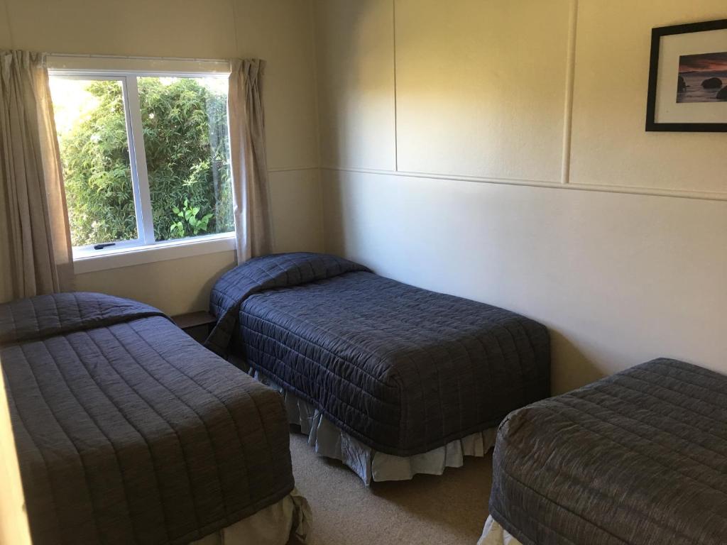 Postel nebo postele na pokoji v ubytování Alma Motel