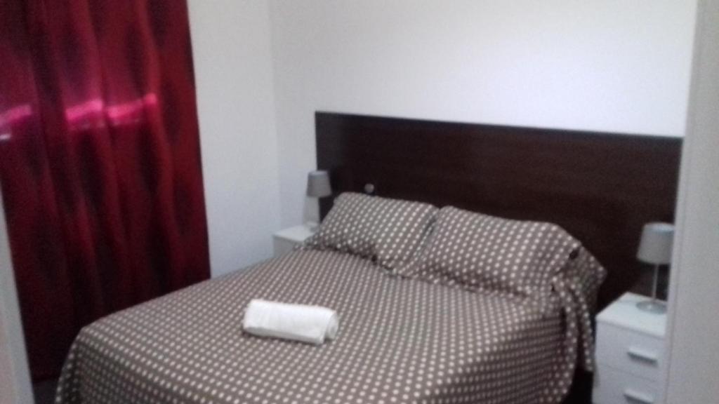 Postel nebo postele na pokoji v ubytování Apartamentos Turísticos Los Ángeles