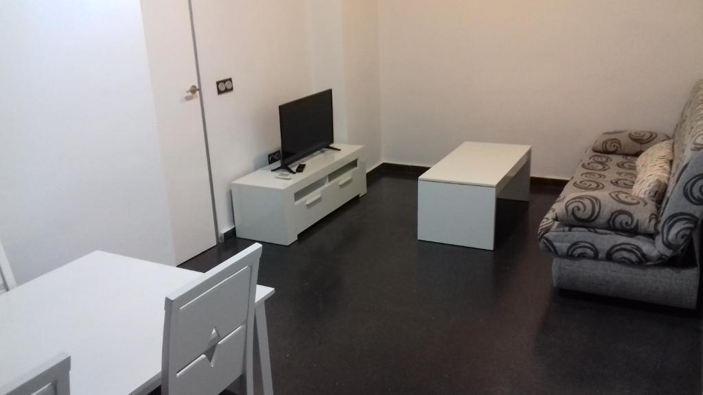 TV a/nebo společenská místnost v ubytování Apartamentos Turísticos Los Ángeles
