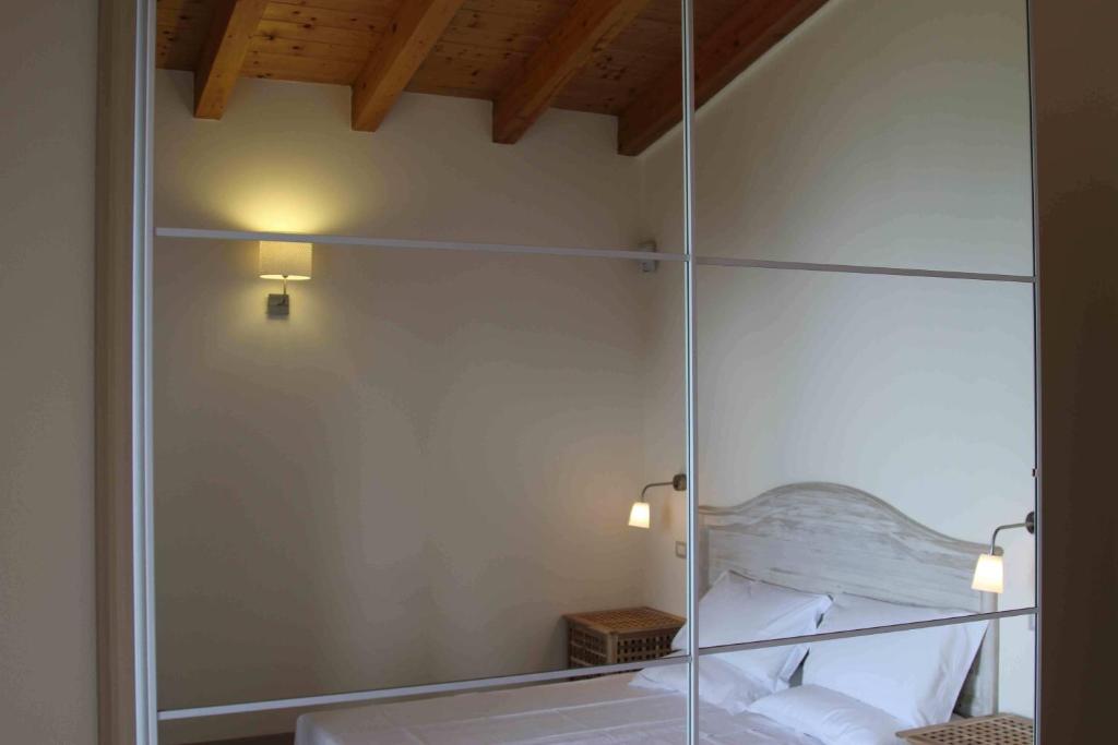 Łóżko lub łóżka w pokoju w obiekcie Villa degli Ulivi