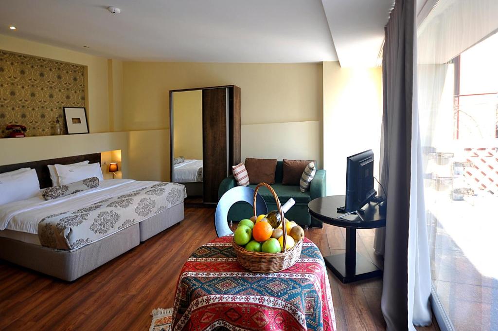 Postel nebo postele na pokoji v ubytování Tekla Palace By Urban Hotels