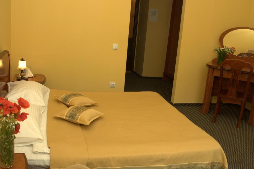 Postel nebo postele na pokoji v ubytování Wien Hotel