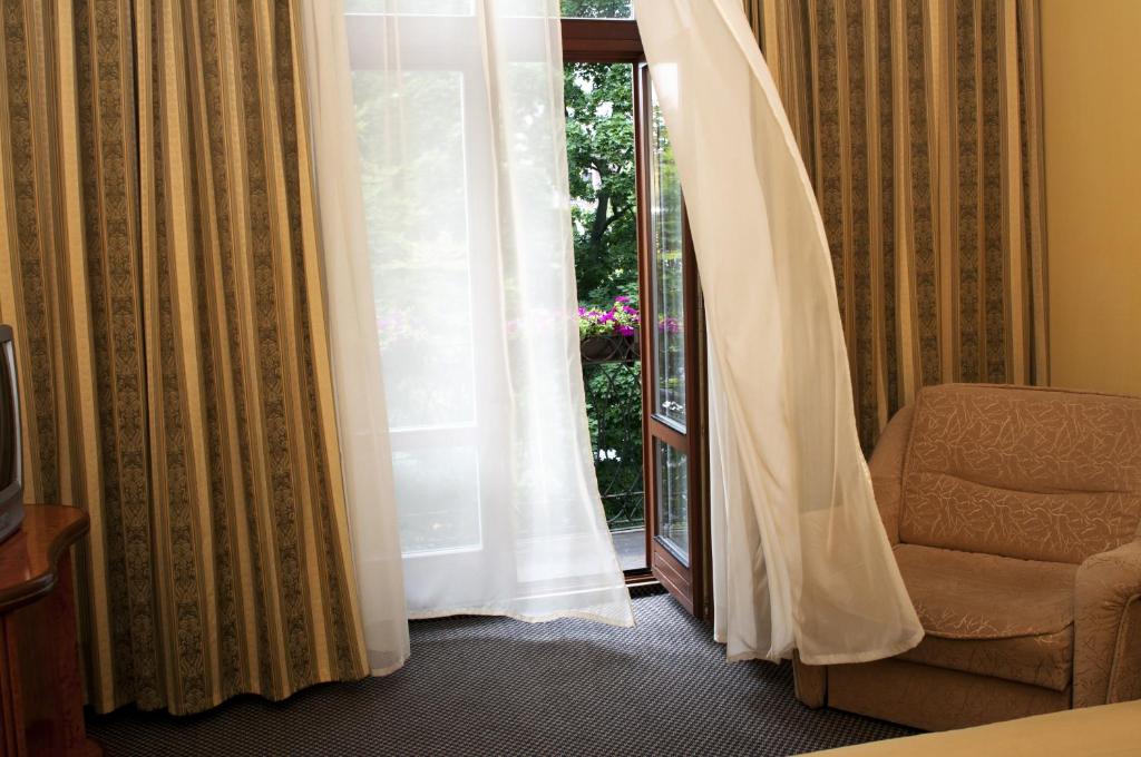 Postel nebo postele na pokoji v ubytování Wien Hotel