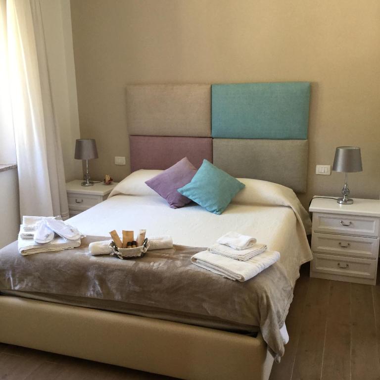 Postel nebo postele na pokoji v ubytování Il Giardino di Daniela Apartments
