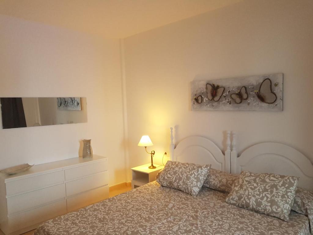 Postel nebo postele na pokoji v ubytování Villa Santana