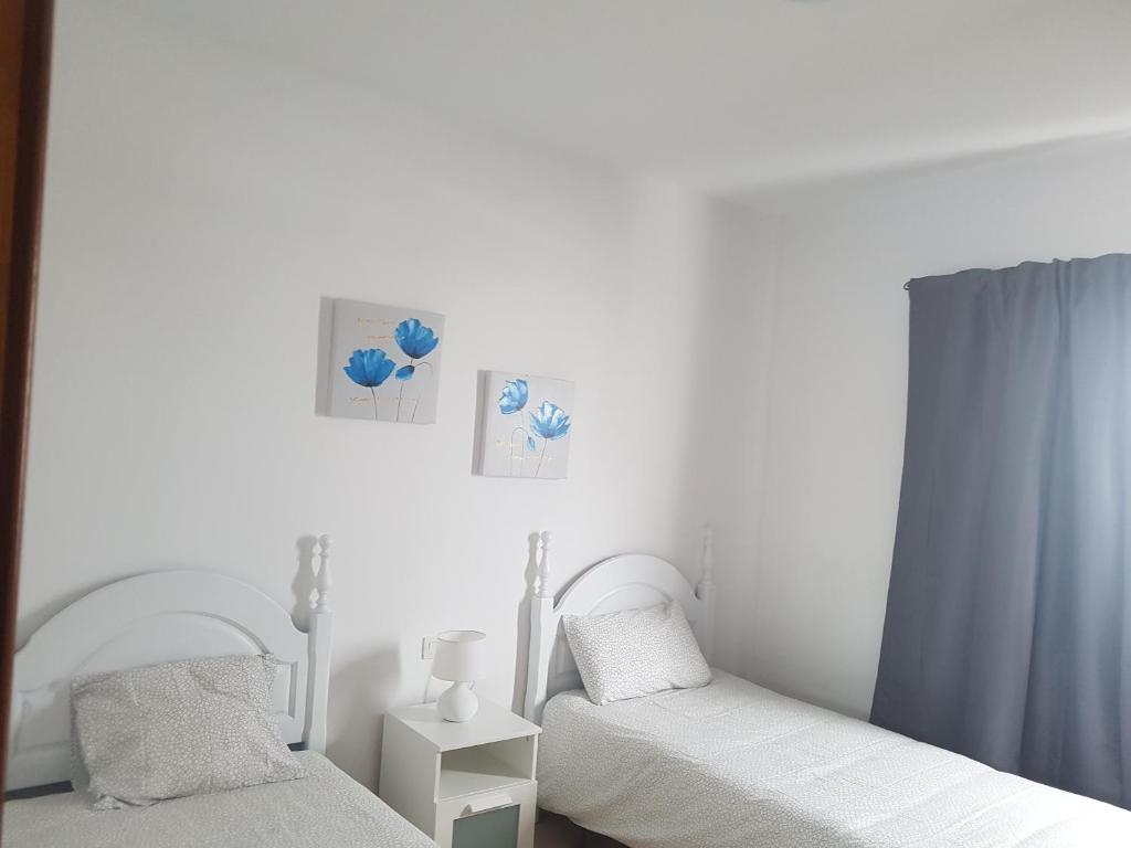 Postel nebo postele na pokoji v ubytování Villa Santana