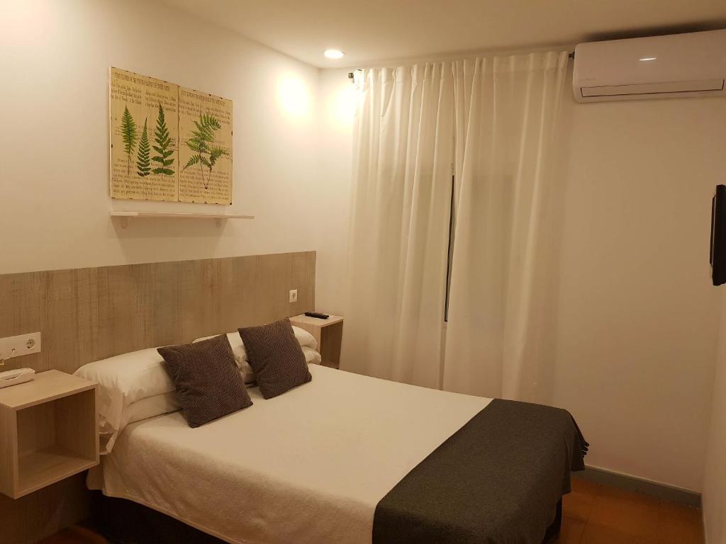 Postel nebo postele na pokoji v ubytování Campomar Playa