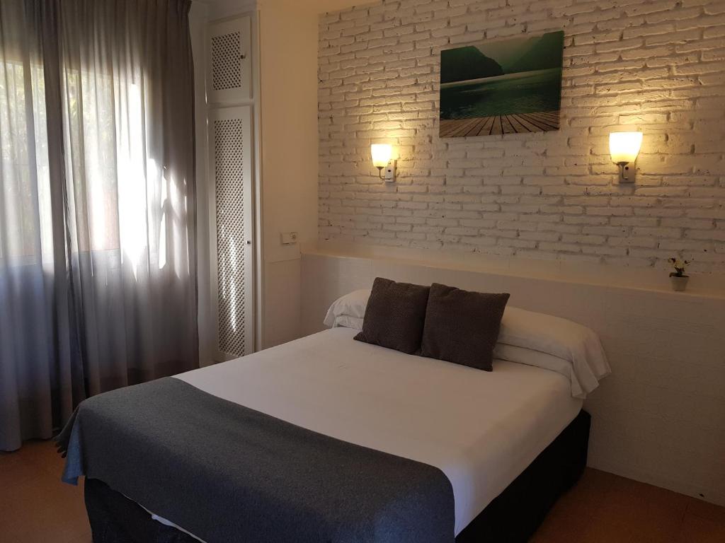 Postel nebo postele na pokoji v ubytování Campomar Playa