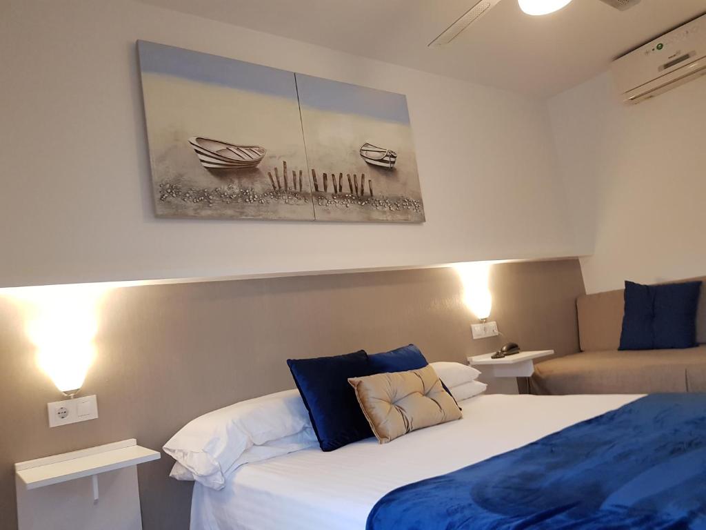 Postel nebo postele na pokoji v ubytování Campomar Playa
