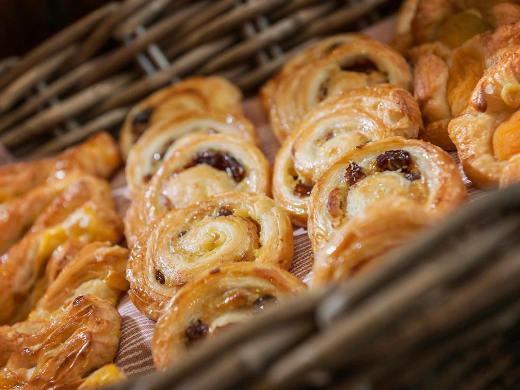 a bunch of pastries sitting in a basket at Pensiunea Junior in Cluj-Napoca