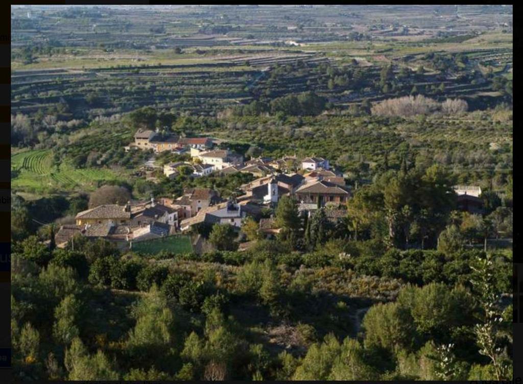 an aerial view of a village on a hill at Casa Rural Carricola in Carrícola