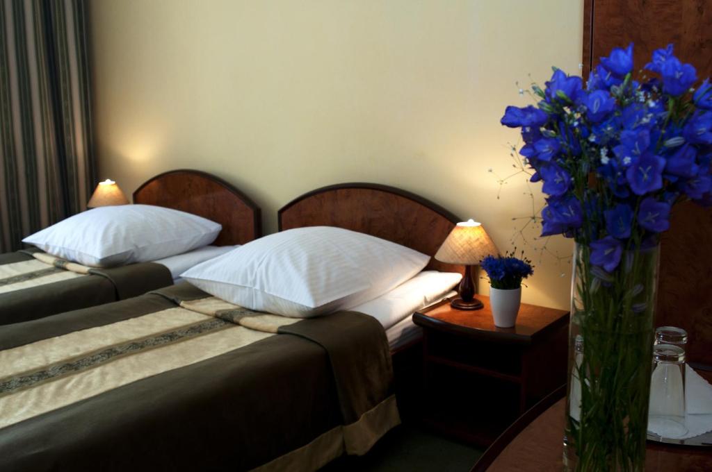 Postel nebo postele na pokoji v ubytování Wien Hotel