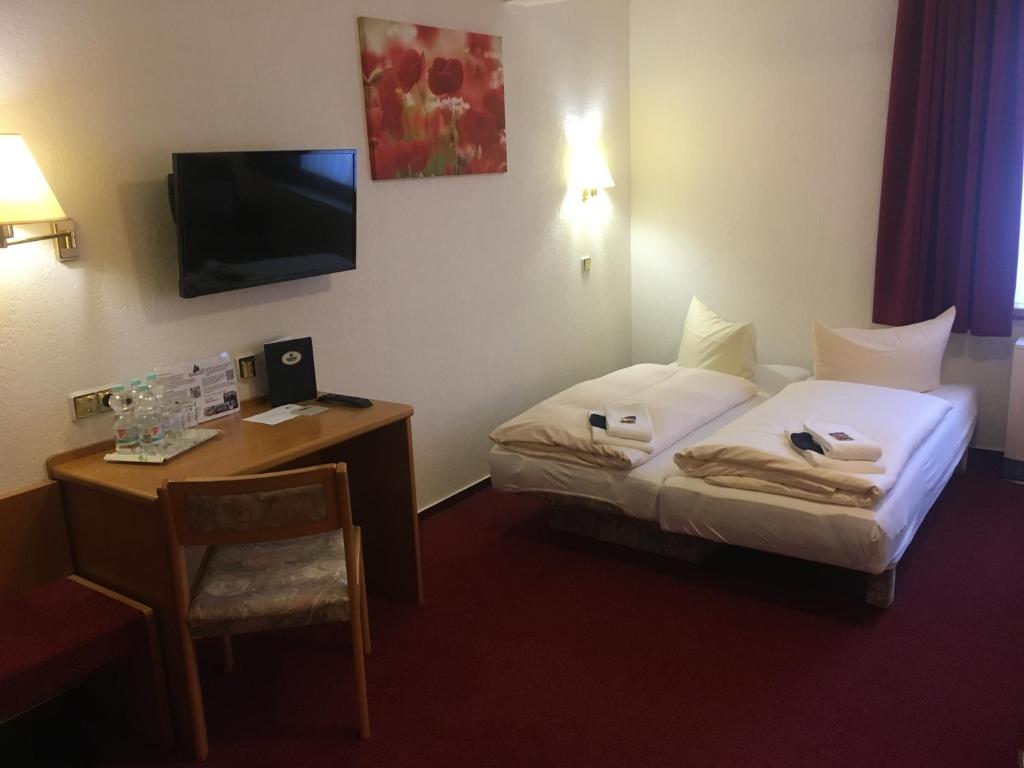 Postel nebo postele na pokoji v ubytování Hotel & Restaurant Druidenstein
