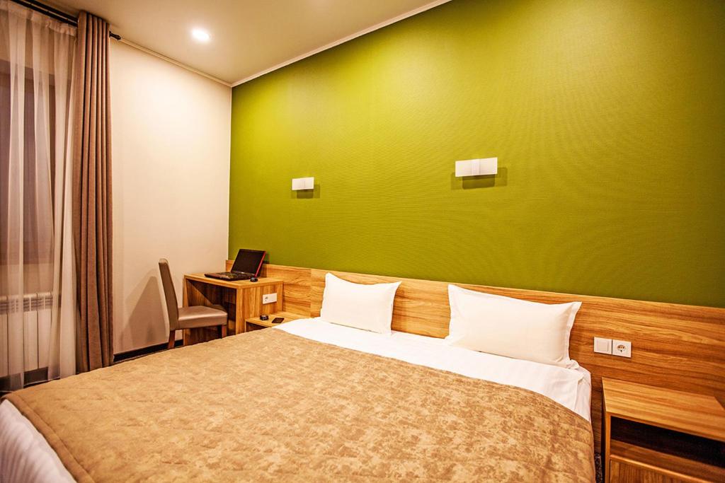 Postel nebo postele na pokoji v ubytování Lumarc Hotel