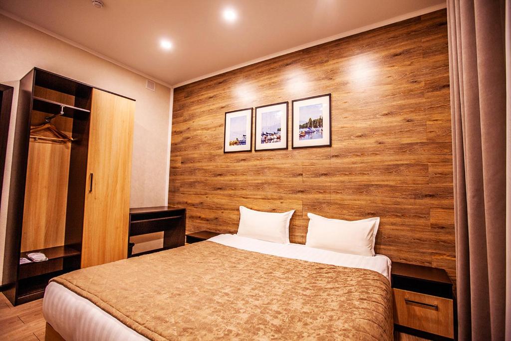 Postel nebo postele na pokoji v ubytování Lumarc Hotel