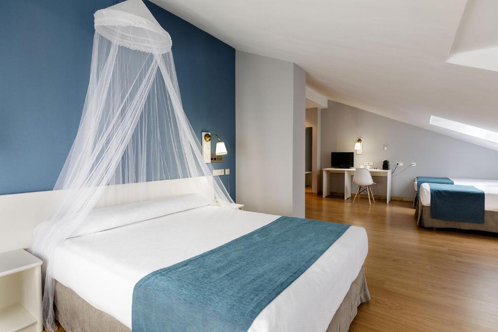 
Cama o camas de una habitación en Hotel Jakue
